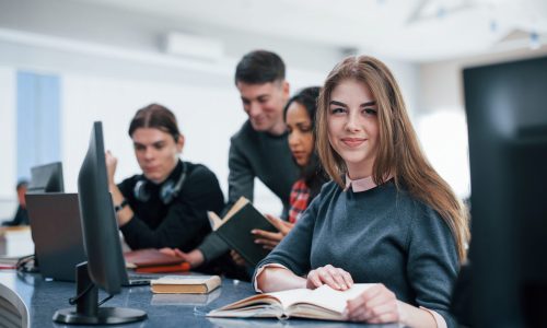 Positive mood. Group of young people in casual clothes working in the modern office.